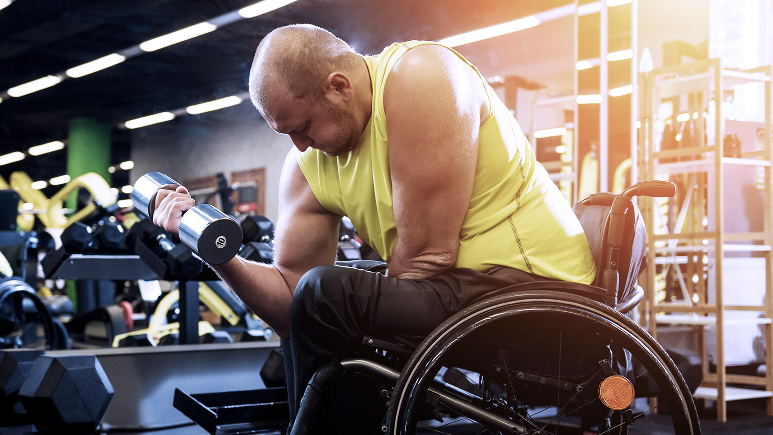 Disabled man trainining in rehabilitation center