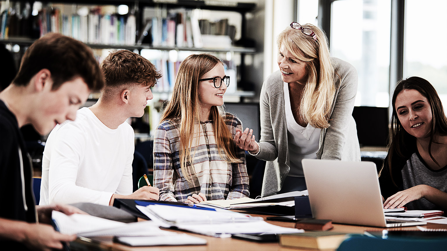 A group of college students with an instructor