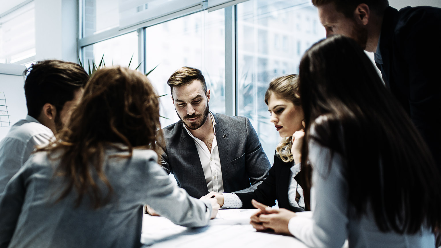 Employees discussing goods and services to be procured 