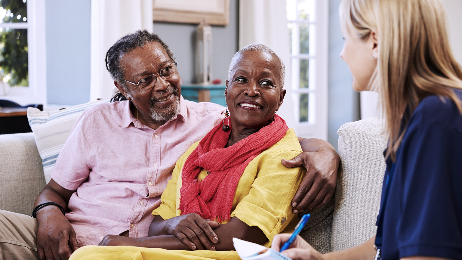 Support worker visits senior couple