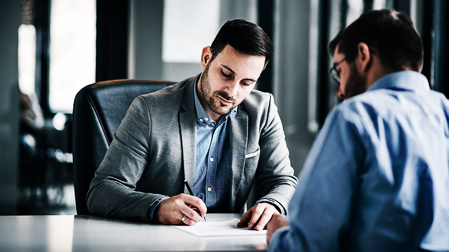 A person signing a contract