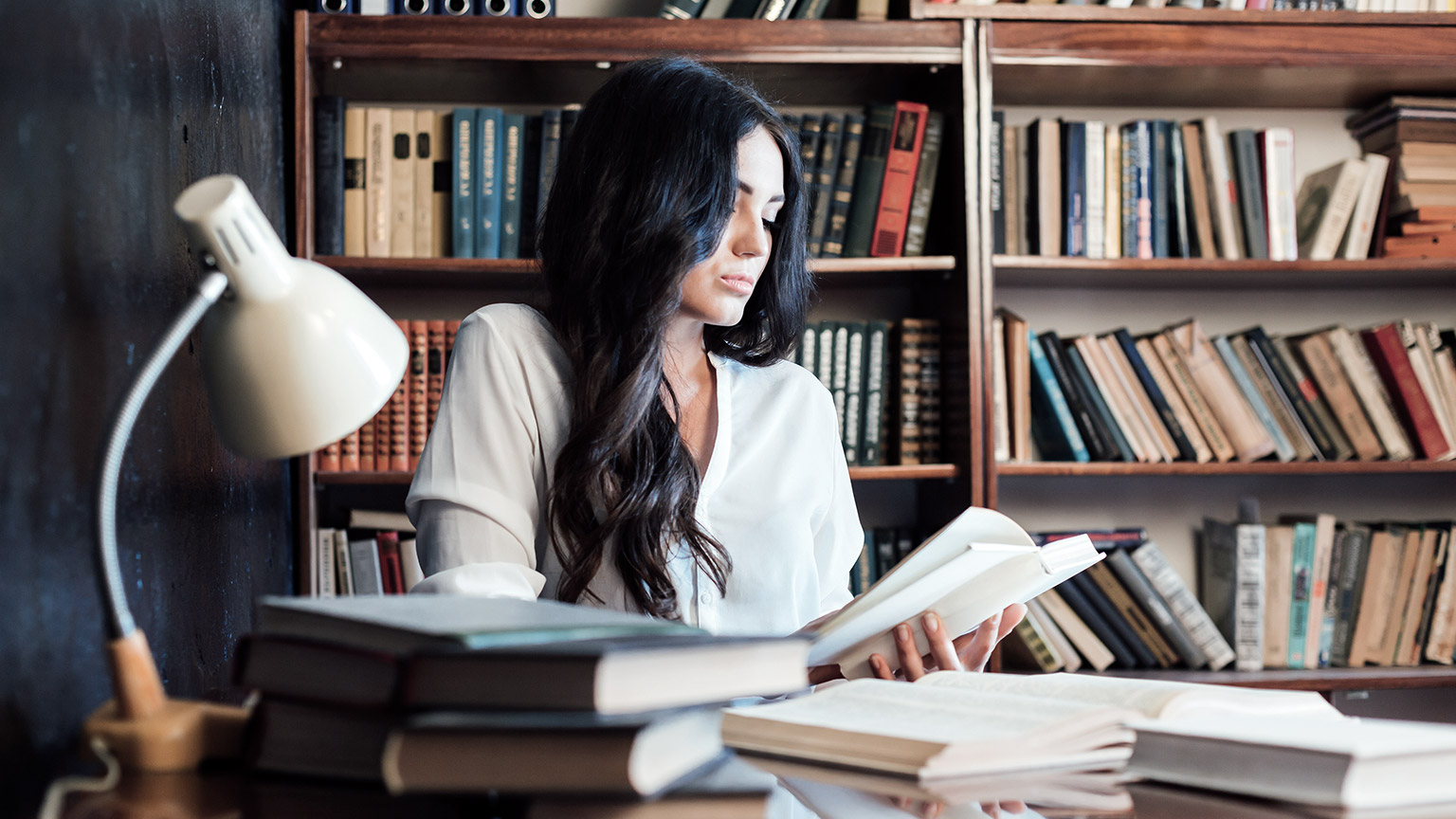 Girl reading inside a library