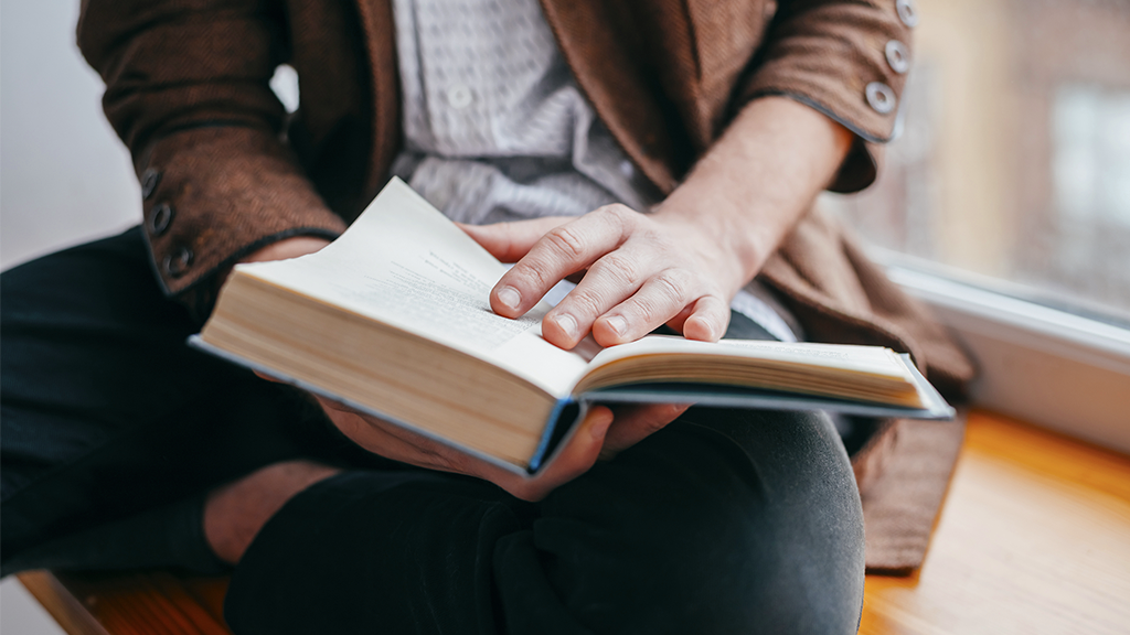 Young man reading a book