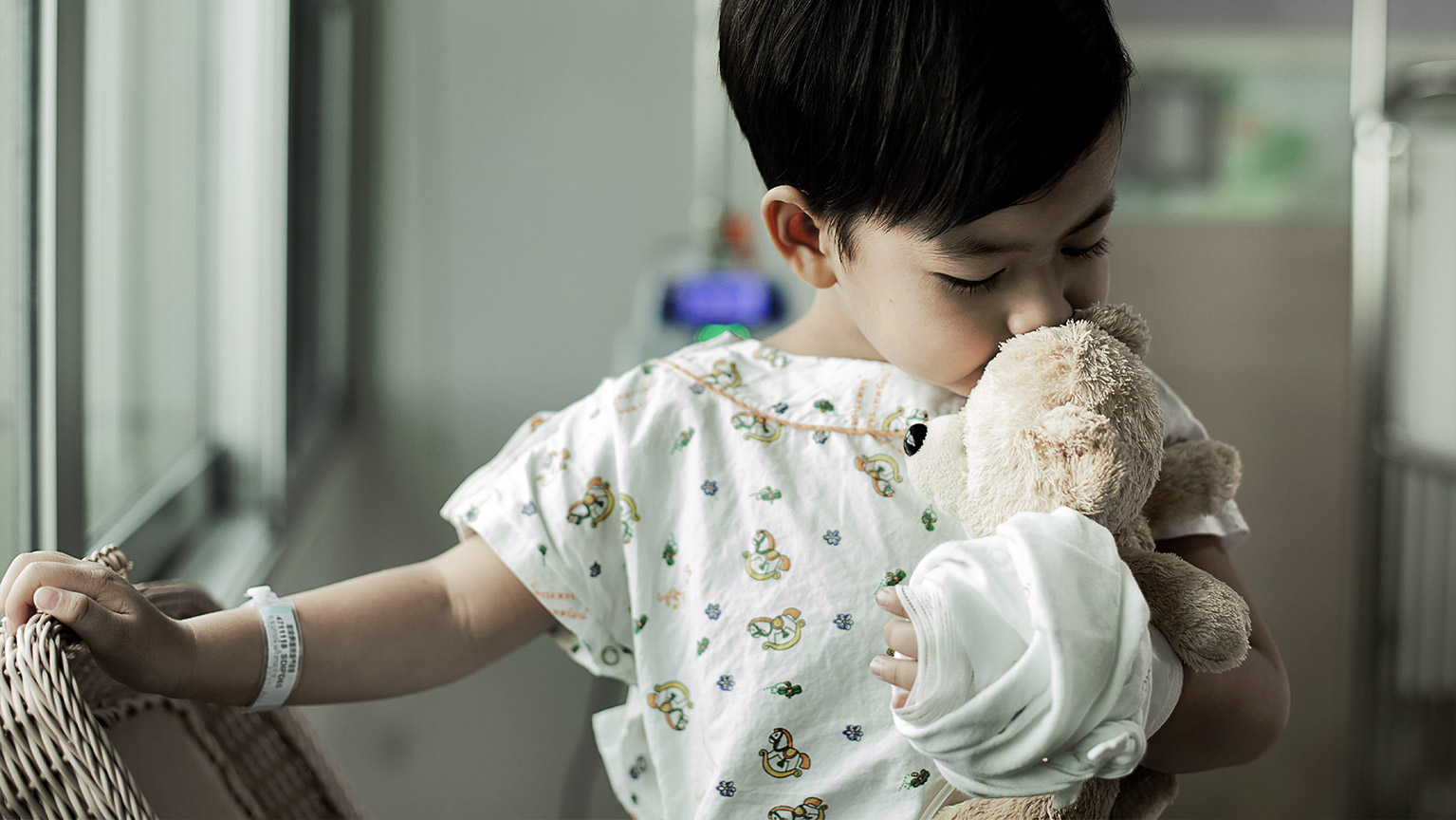 An ill child being taken cared for in a hospital