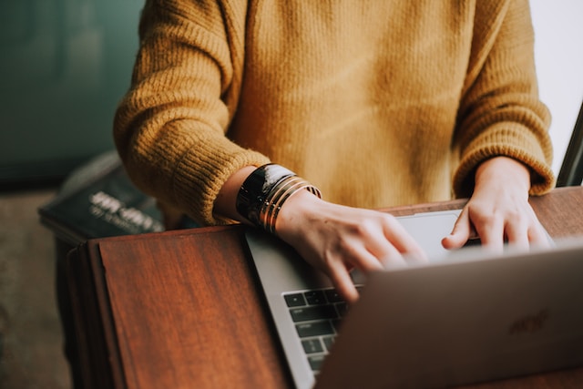 typing on a laptop by Christin Hume on Unsplash