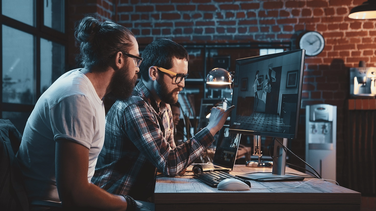 People at a computer looking at animation design