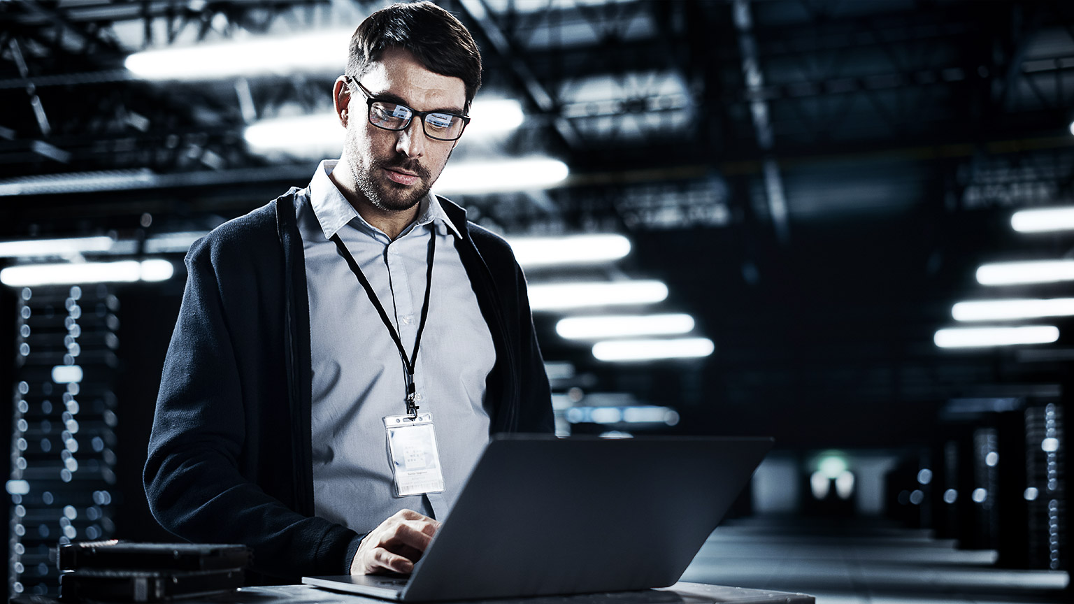 A person using a laptop in a data center AWS