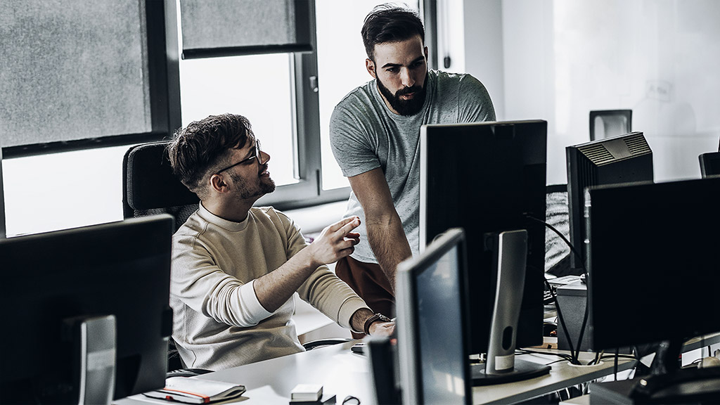 Two people with computers