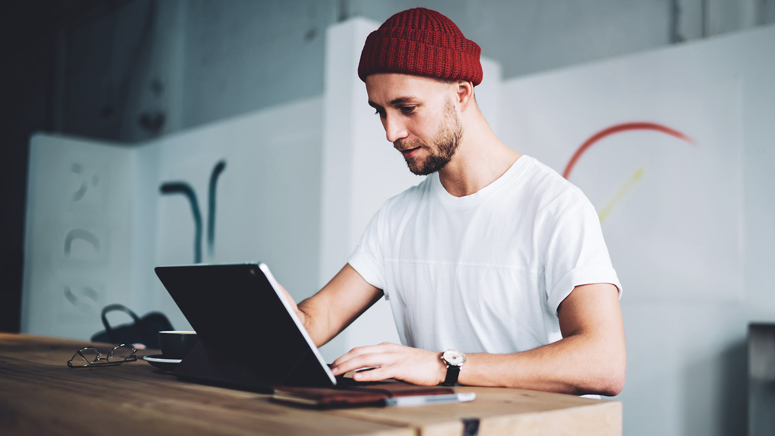 A hipster designer working in a modern office space