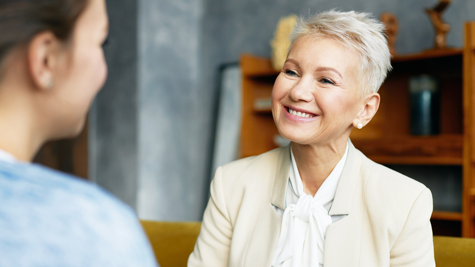 A counsellor listening to a client