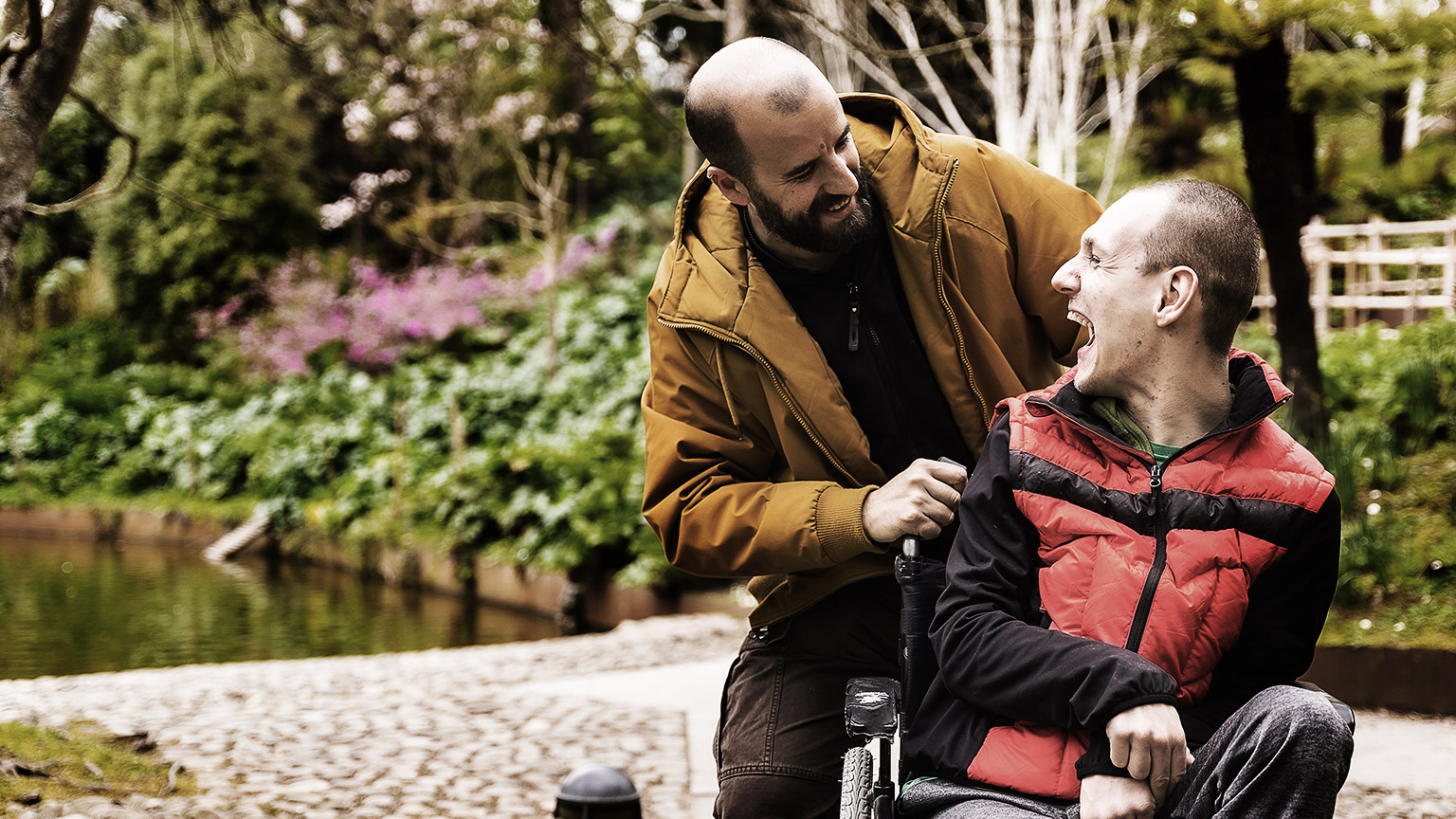 A happy person spending time being supported by a carer