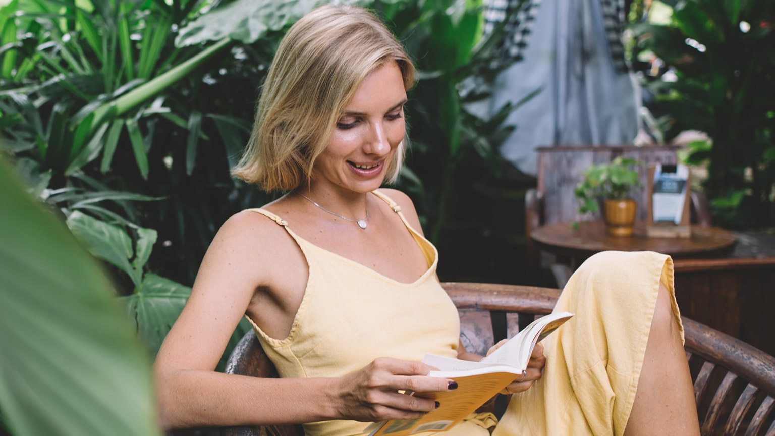 A person reading in a garden