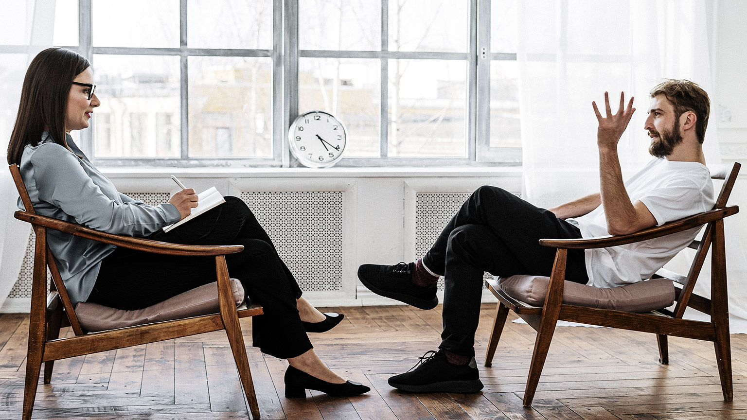 Woman interviewing a man