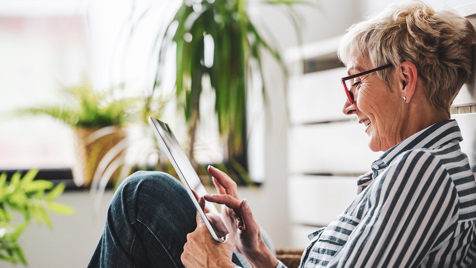 A person reading resources on a tablet device