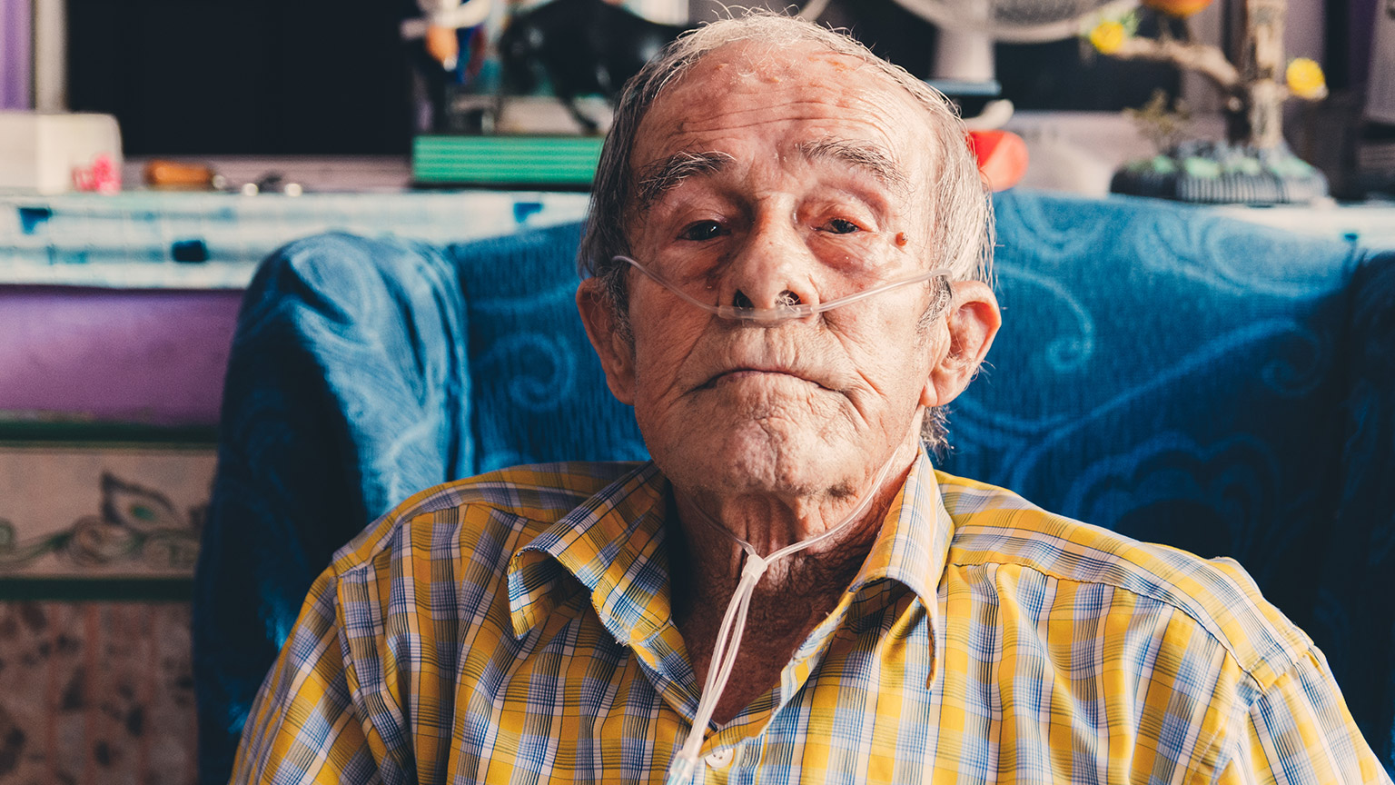 An elderly patient with breathing assitance