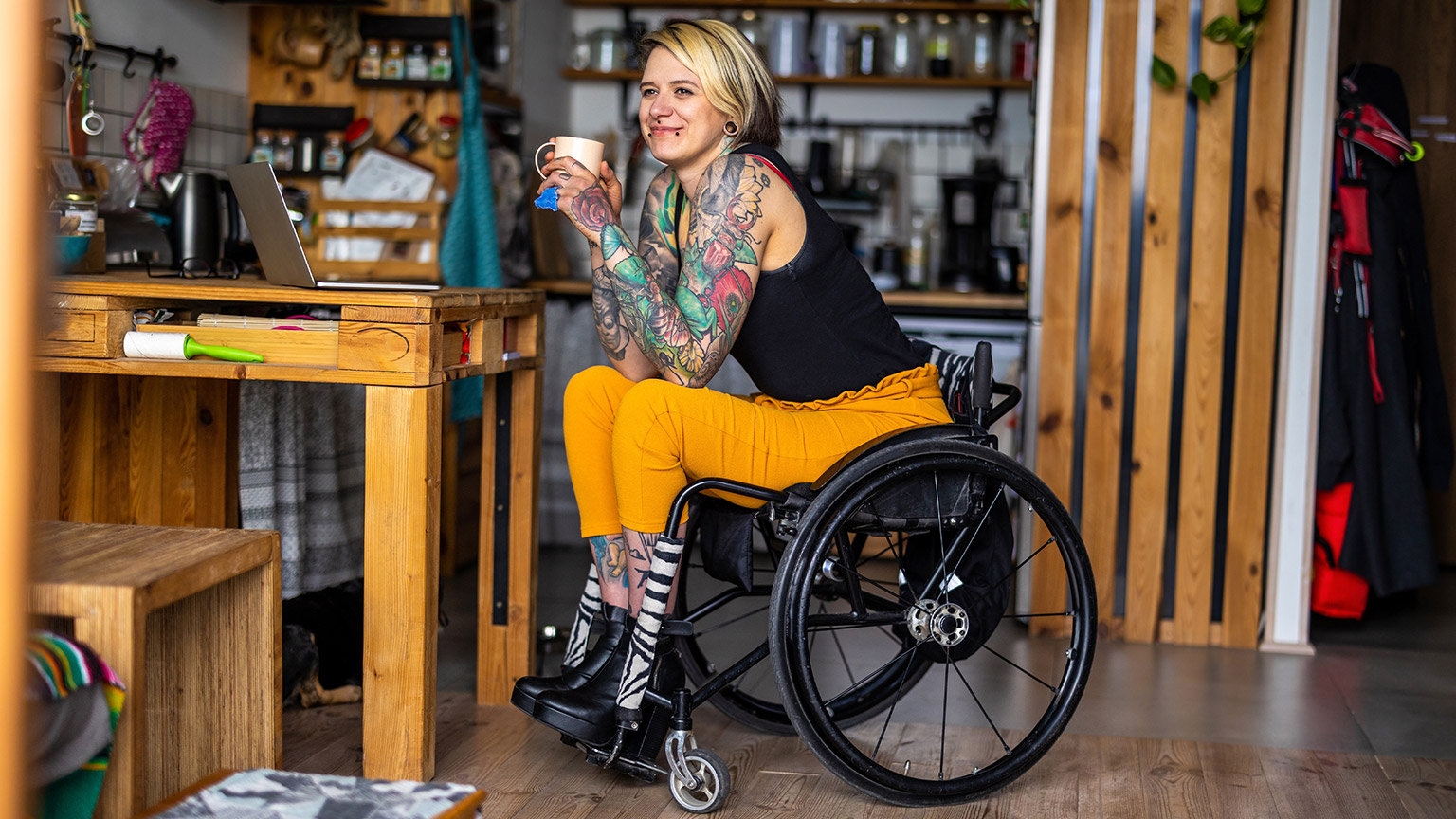 A person in a wheelchair in her home