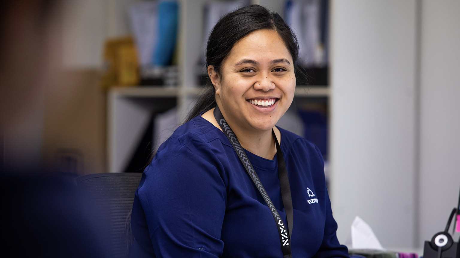 An aged care student smiling at the camera