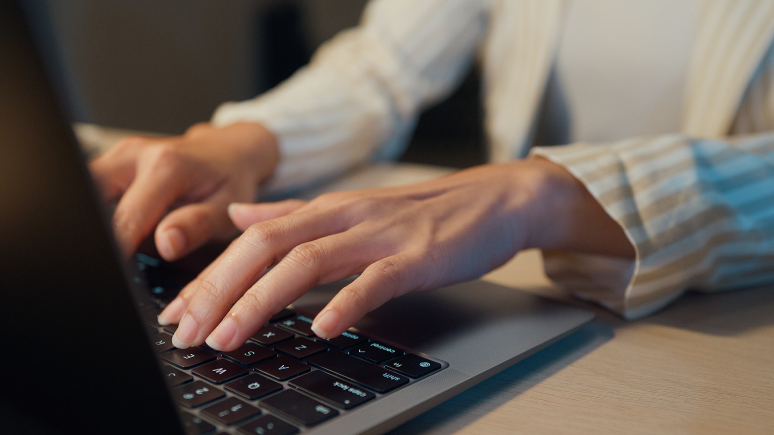 A close view of a person typing on a keyboard