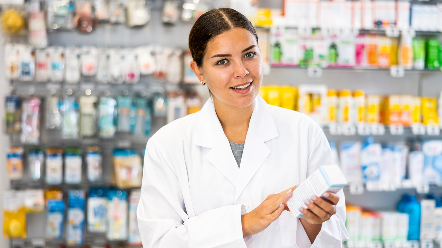 A pharmacist with a quizzical look on their face