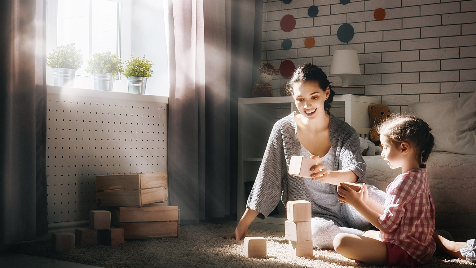 mother and daughter playing blocks