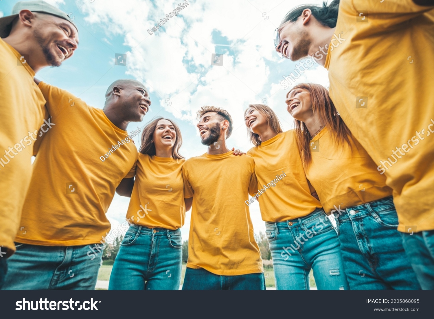 Young people team hugging