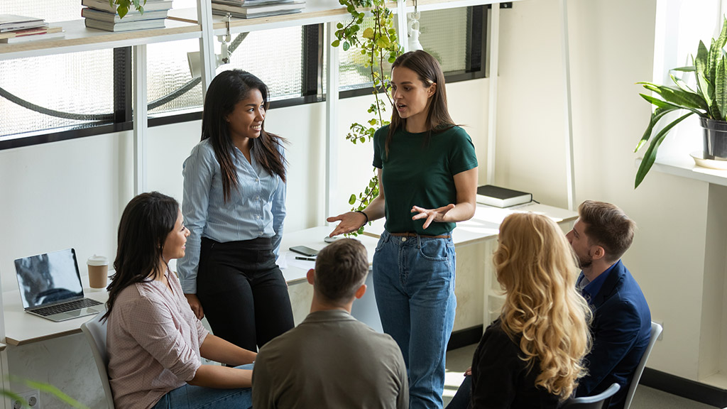 Diverse multiracial businesspeople gather at briefing brainstorm discuss company business ideas together