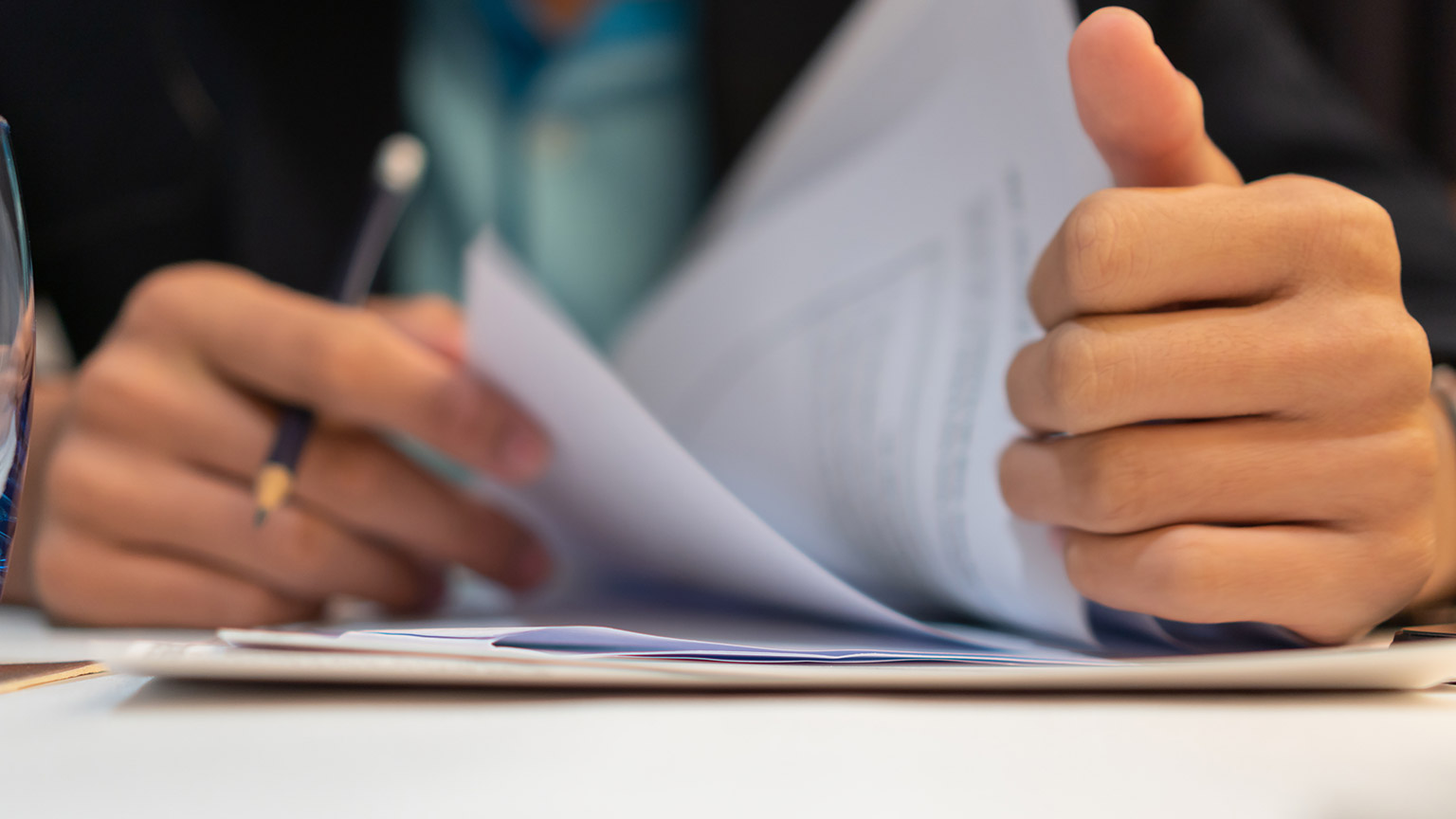 A close view of a person reading documents