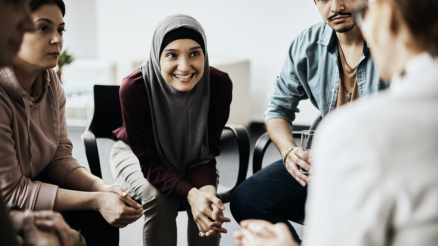 A group counselling where participants are progressing happily