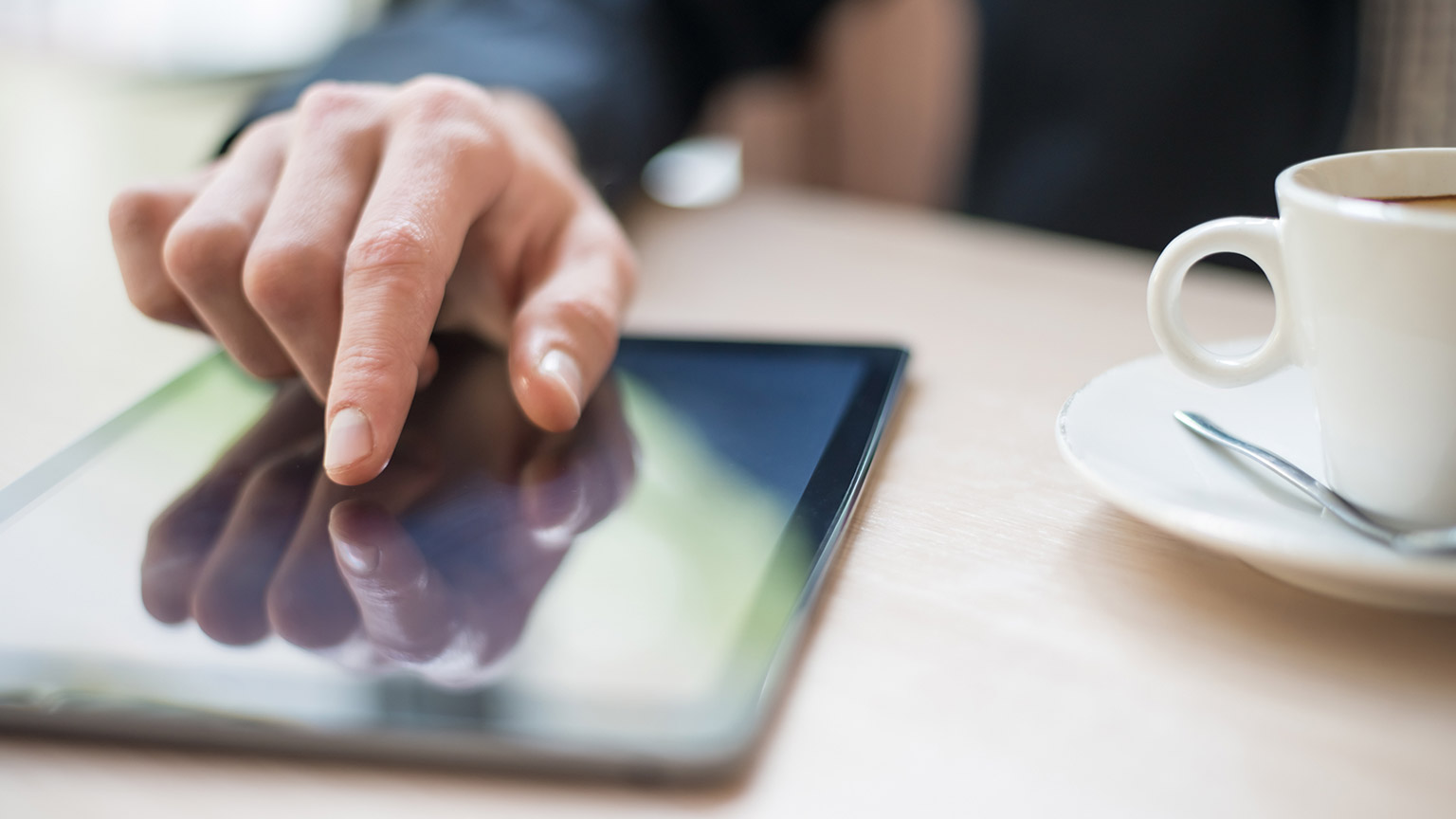 A close view of a person accessing information on a tablet device