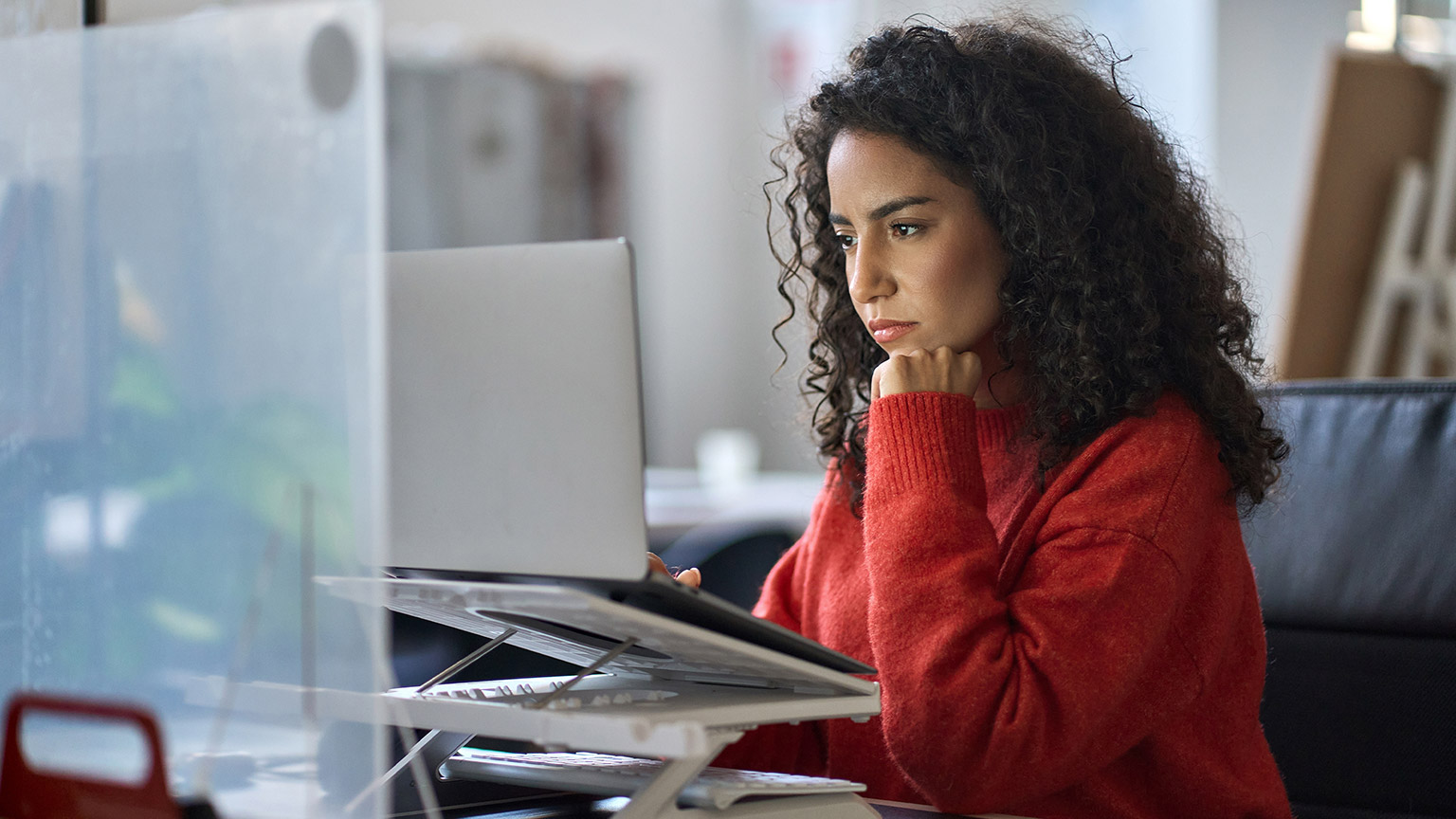 A person typing on a laptop