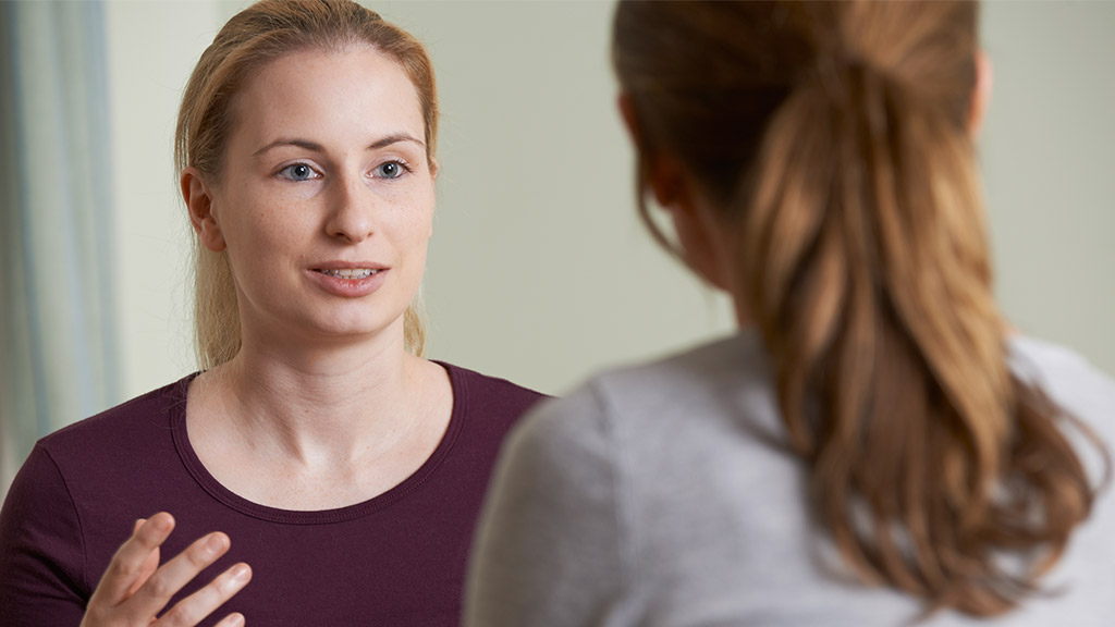 Young Woman Discussing Problems With Counselor