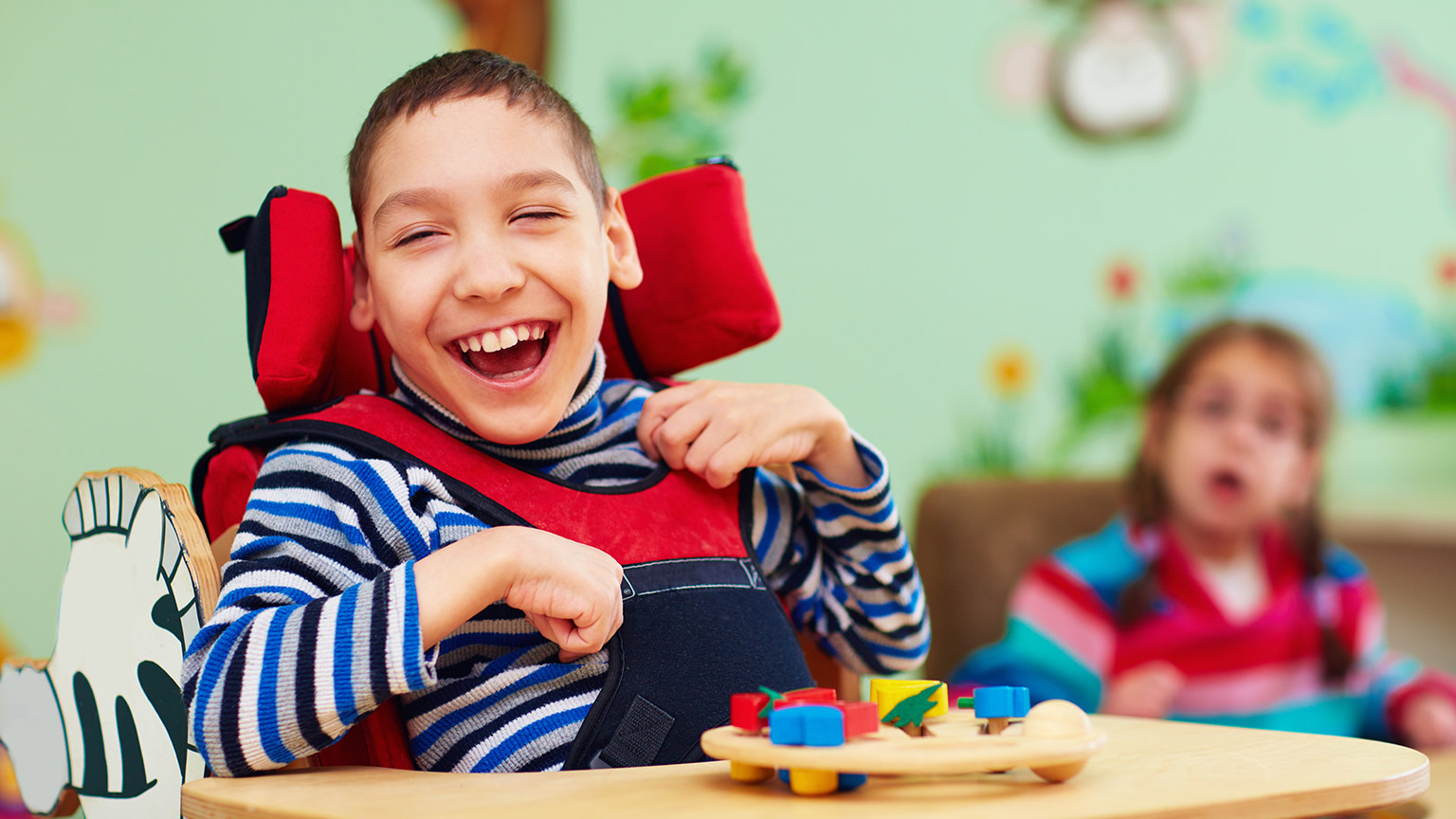 A happy young child in a childcare facility