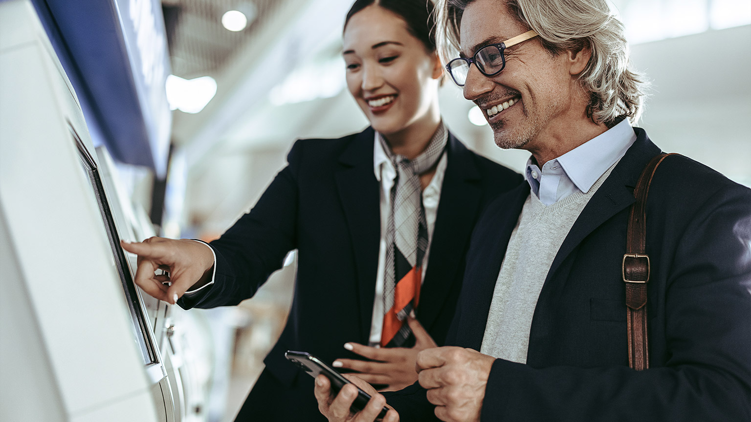 Friendly airport receptionist with a customer