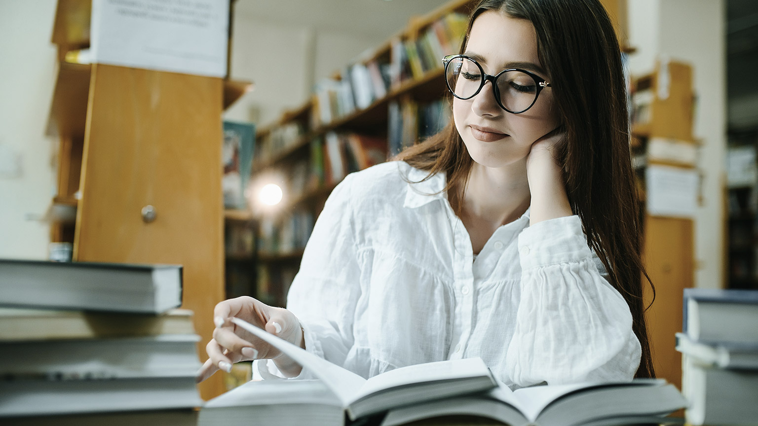 student reading books