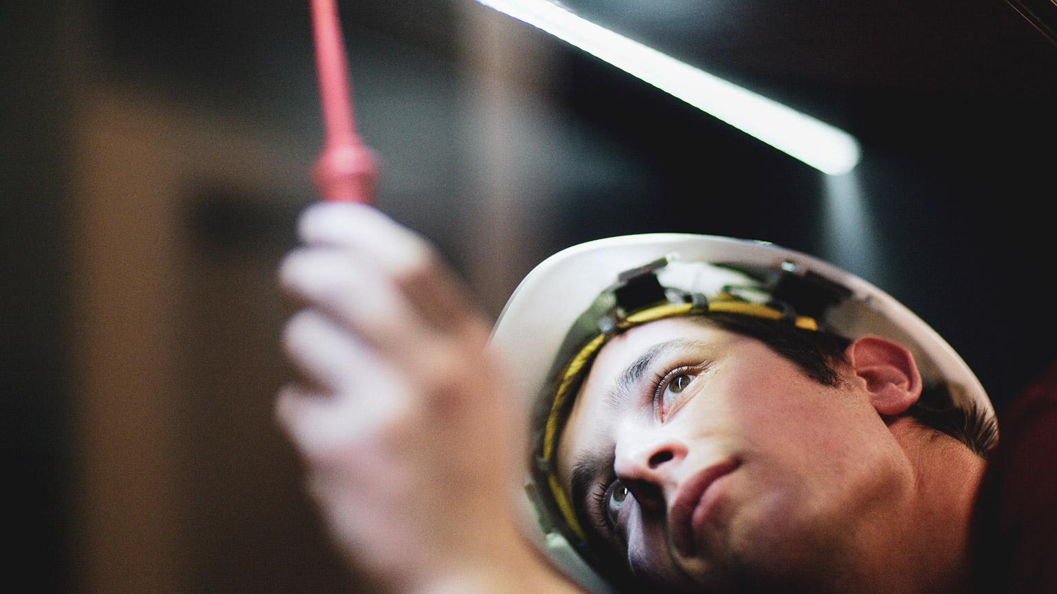 Close-up of young electrician working