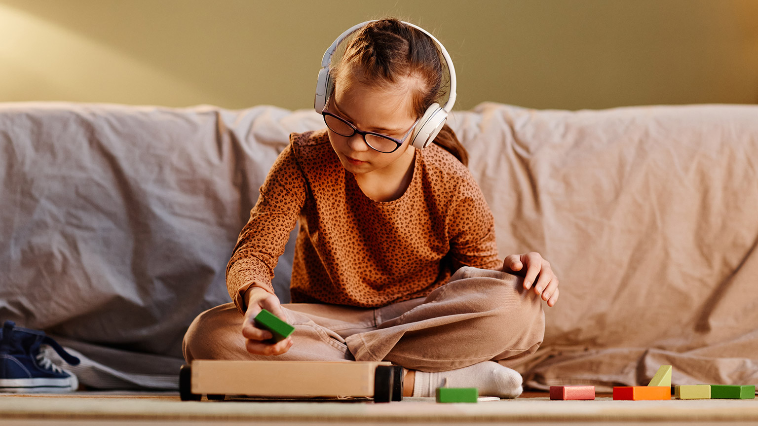 A young student using learning aids