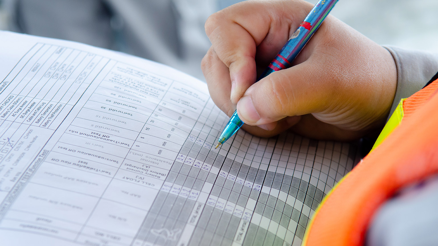 A person doing safety paperwork