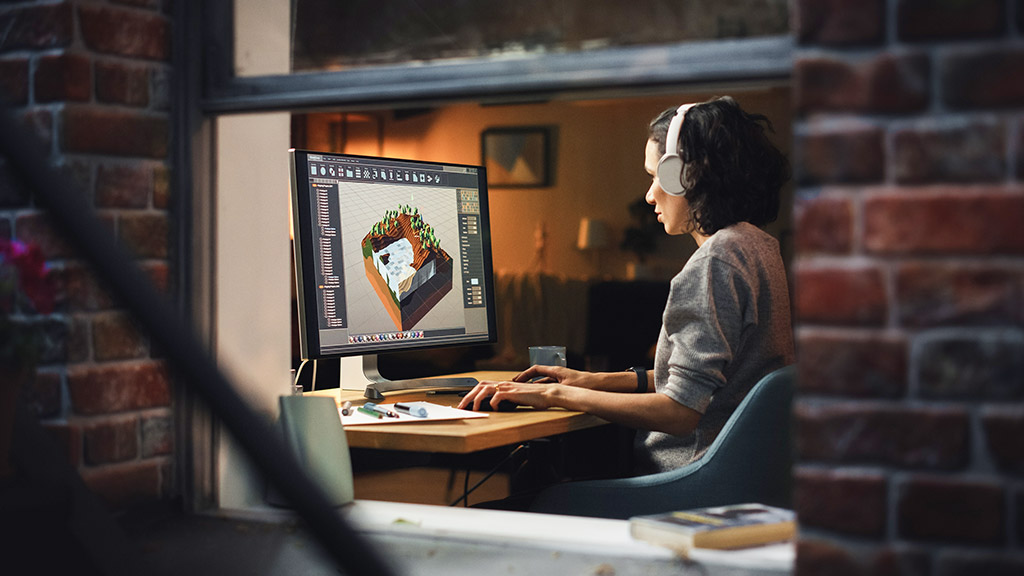 woman creating metaverse and design video game shot into the apartment window