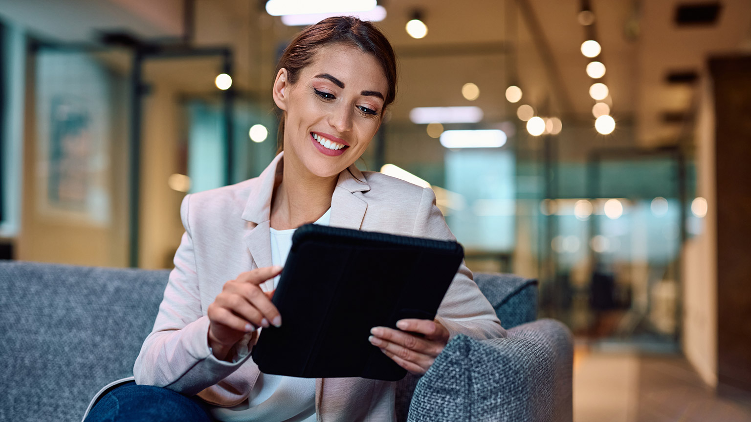 A person reading information on a tablet device