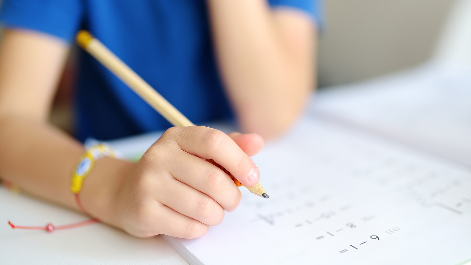 A boy working on math problems at school