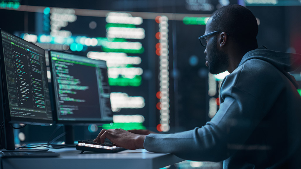 Black Male Programmer Working in Monitoring Room