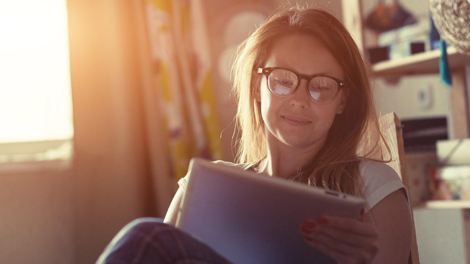 A person reading information on a tablet device