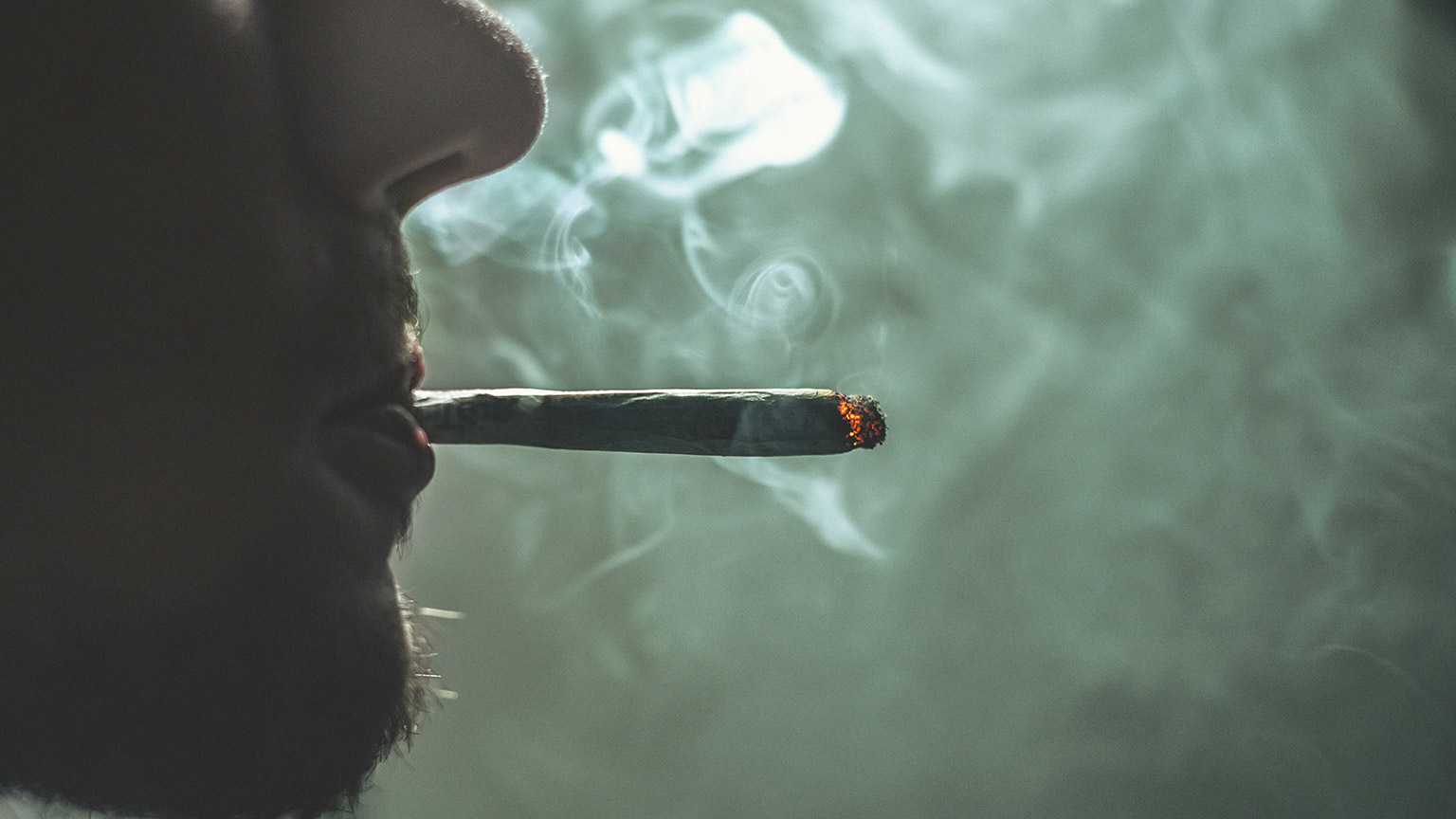 A close view of a person smoking cannabis