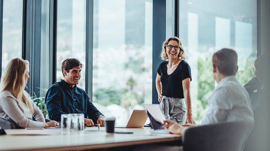 Office colleagues having casual discussion during meeting in conference room