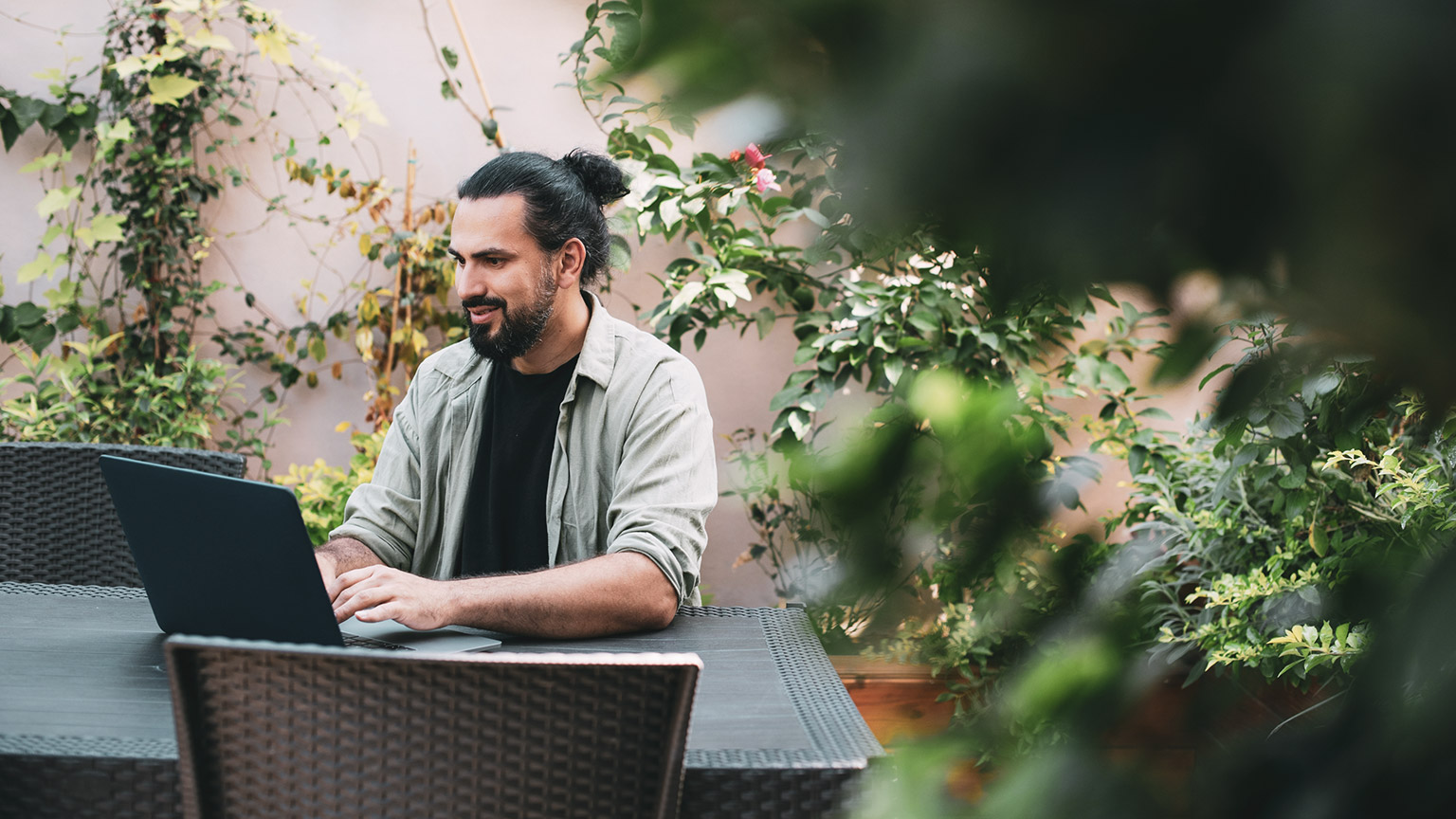 A designer working on a project on a laptop