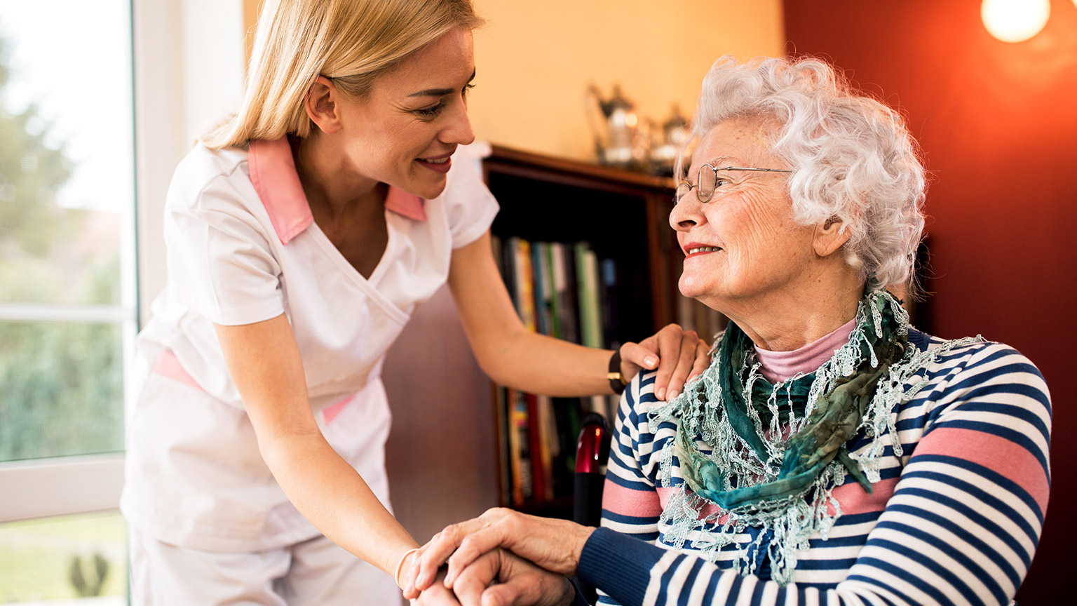 A carer and client in a home setting