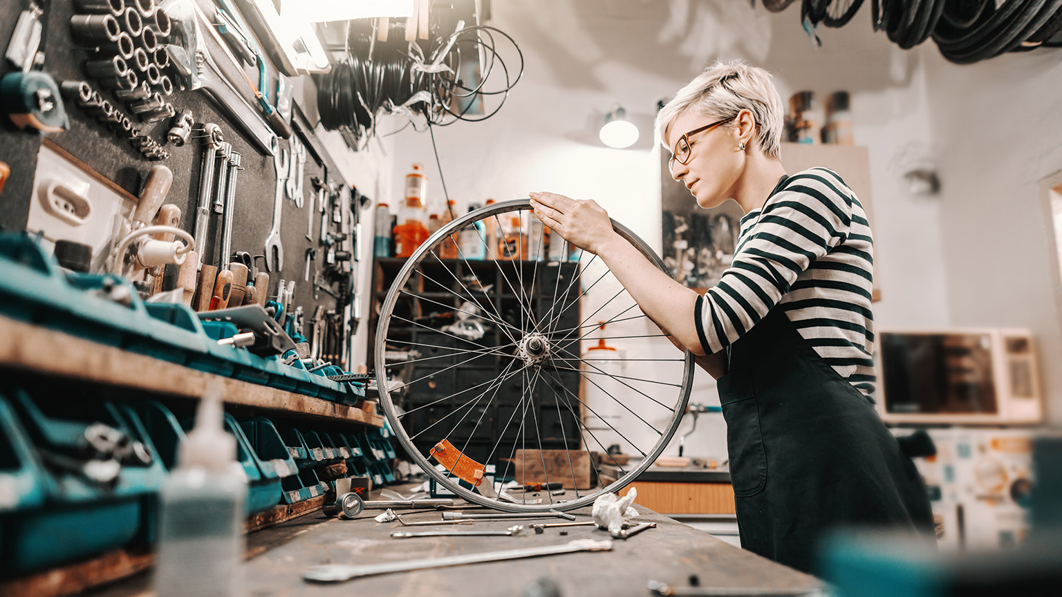 A bike mechanic in a workshop