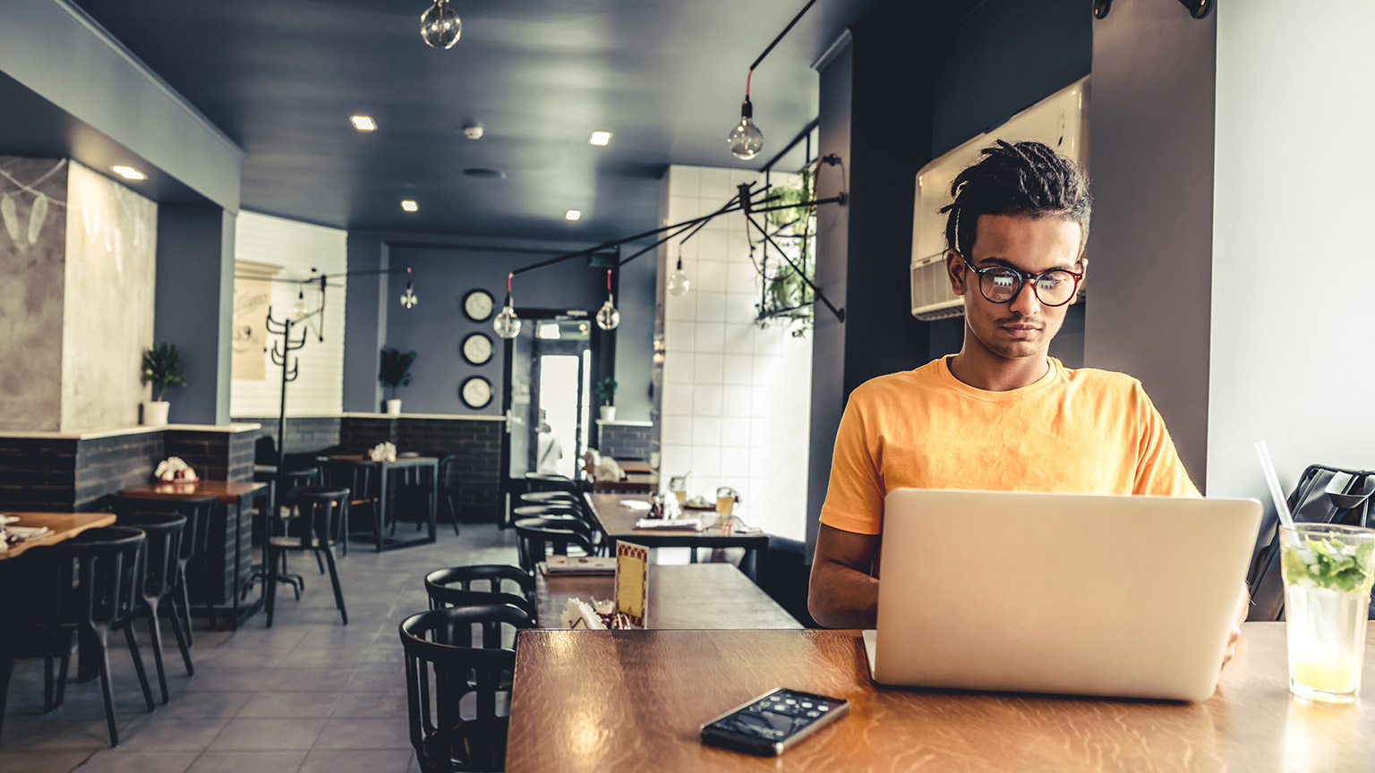 A freelancer reading information on a laptop