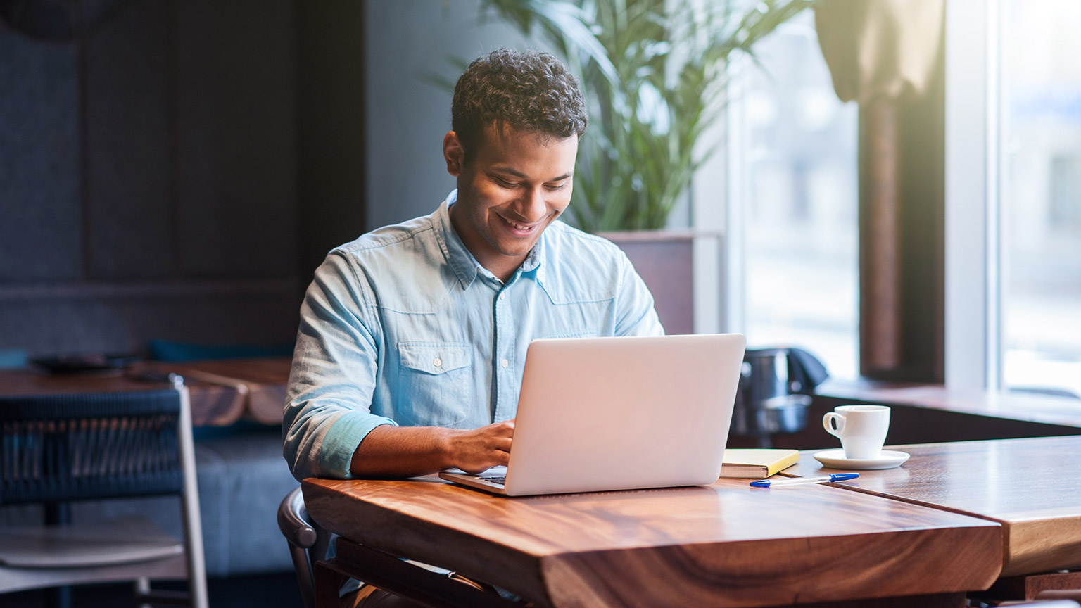 A person typing on a laptop