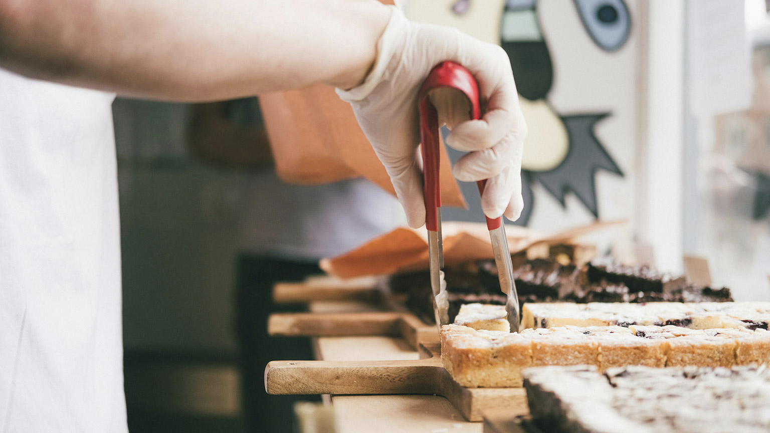 A close view of a baker displaying his wares